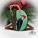 A hand-painted pileated woodpecker on a wood slice Christmas ornament available at Cove Creek Photography.